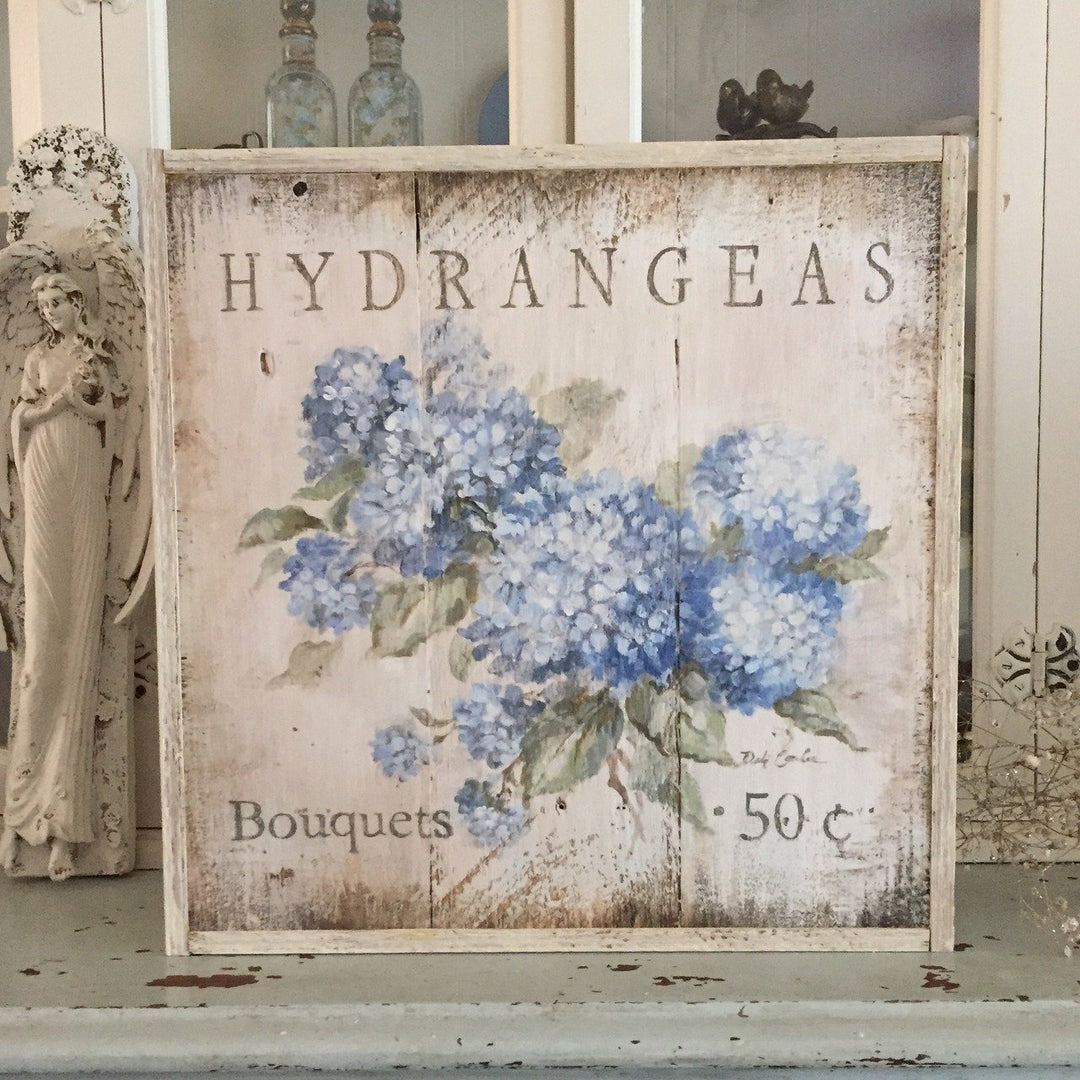 Beautiful Blue Hydrangeas on an antique white, distressed, vintage shabby chic style background. Also works with modern farmhouse. The writing states: Hydrangea bouquets 50 cents. A rustic wooden sign that would be great in kitchen, bath, or anywhere